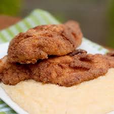 This dish, inspired by generations of backyard fish fries in the heart of cajun louisiana, is rustic southern fare at its best. Fried Catfish With Cheese Grits From Never Enough Thyme
