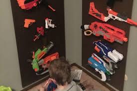 Attach an s hook to the towel rack for each nerf gun you want to hang, spacing them out evenly along the rail. Build A Nerf Gun Rack Super Cheap