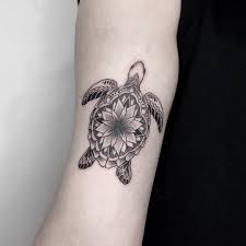 Awesome hawaiian tribal turtle with flowers tattoo. Updated 45 Majestic Sea Turtle Tattoos August 2020