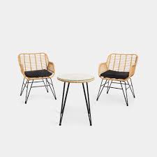 You also get two soft, washable back and seat cushions and two smaller decorative pillows. Natural Rattan Bistro Dining Set Vonhaus