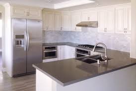 Antique White Kitchen Cabinet With Grey Quartz Countertop Undermount Sink And Pull Out F White Modern Kitchen Grey Countertops Antique White Kitchen Cabinets