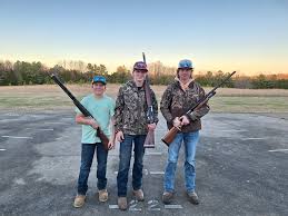 Cameron Haack really was impressed with these young men today -- with their  shooting and their sportsmanship. Left to right, Cameron Mersing, John  Engelman, and Kayden Mersing.
