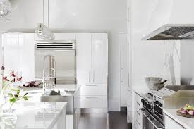 Contemporary Kitchen With Glossy White Cabinets And Steel Apron Sink White Glossy Kitchen White Modern Kitchen White Kitchen Cupboards