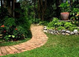 This diy pathway of cedar stepping stones and river rock is looking like a dream and would be a perfect addition to your garden. Diy Garden Paths 7 Thrifty Designs Bob Vila