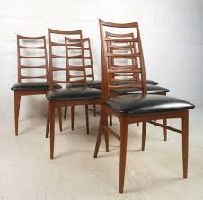 A woodbridge furniture company ladder back arm chair featuring carved wood detailing and a upholstered seat in a light cream fabric. Teak Ladder Back Chairs 6 For Sale On 1stdibs