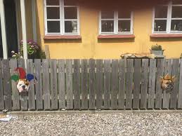 Have a question about our fence and deck installation services? This Bulldog Loves Watching The Street Through A Hole So His Owners Paint 2 Costumes On The Fence Bored Panda