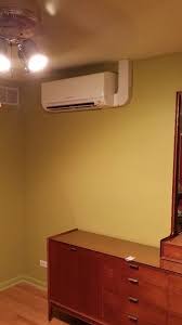 Indoor Mitsubishi Unit Mounted On An Interior Wall W Concealed Power Refrigeration And Air Conditioning Ductless Heating And Cooling Electronics Store Design
