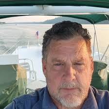 What is the name of a used car lot in New Albany that sold used muscle cars  near 10th street?