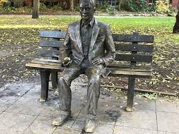 It shows turing seated and looking at a german enigma machine. Sit Next To The Man Himself Review Of Alan Turing Memorial Manchester England Tripadvisor