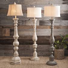 Crafted from manufactured wood, this boxy design features an open frame with three manufactured wood shelves to store framed family photos. Wooden Spindle Floor Lamp Online
