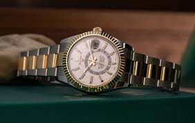 Rolex skydweller blue face watch baguettes and round diamonds honeycomb setting. The Rolex Sky Dweller In Steel And White Gold Review