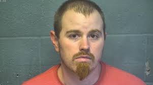 Oklahoma County Sheriff's Investigators have charged 27 year old Aaron  Houchins with Shooting with Intent to Kill. Houchins is accused of shooting  a woman at a home