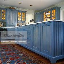 Kitchens Detail Of Island Cabinets With Blue Transparent Stain Image C Sheltere Stained Kitchen Cabinets Beach House Kitchen Cabinets Beach House Kitchens