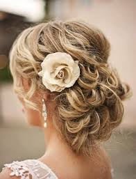 Romantic Curly Updo Hairstyle With Flower Mother Of The Bride Hair Curly Wedding Hair Wedding Hair And Makeup