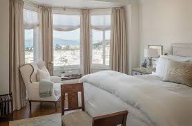 Consider curtain panels with button accents or a contrasting border for an unexpected pop of color. Bay Window Blinds Ideas How To Dress Up Your Bay Window Beautifully