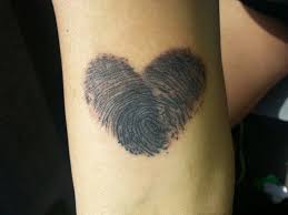 It is a reflection of their love and feelings. Thumbprint Heart Tattoo