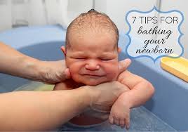 Lay your baby on a flat surface, such as the floor, changing table, counter. How To Bathe Your Newborn Healthy Headlines