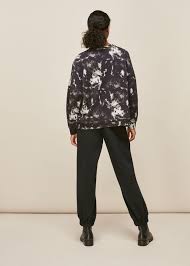 You should leave the garment in the dye for 10 to 30 minutes, depending on the richness of color you are trying to achieve. Black Multi Tie Dye Sweatshirt Whistles Whistles