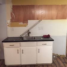 small kitchen cabinets, sink and faucet
