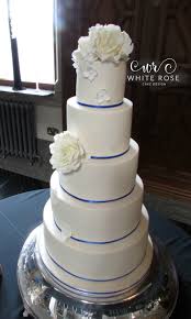 Wedding cakes award winning retford royal blue wedding nancy s cake designs 7 royal blue wedding decorations for a wedding cakesroyal blue wedding cake designs wallpaperroyal blue unique wedding cake designssimple royal blue midnight wedding cake designsroyal blue two tier wedding cakes heart shape cake png image transpa on seekpngroyal blue. Five Tier Ivory Roses And Royal Blue Wedding Cake White Rose Cake Design