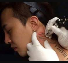 G dragon tattoo gd tattoo cover tattoo daesung vip bigbang choi seung hyun g dragon fashion dragon icon big bang kpop. G Dragon Getting His Angel Tattoo G Dragon Bigbang G Dragon G Dragon Fashion
