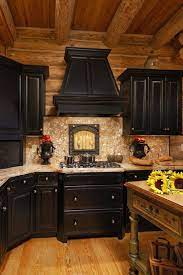 This log cabin kit would make a great permanent residence, there is plenty of storage and a covered porch outside to enjoy the views. Popular Kitchen Color Scheme Ideas For Dark Cabinets 20 Log Home Kitchens Log Cabin Kitchens Log Home Interiors