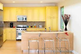 This sandy hue brings out the undertones in wood floors, maximizing the light, cozy feel in this small bedroom. 50 Yellow Kitchen Ideas Photos Home Stratosphere