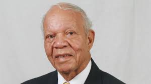 John Compton (1925–2007) •