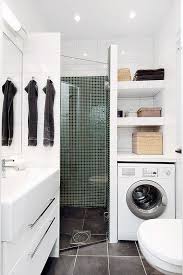 A Tiny Contemporary Bathroom With A Tiled Shower Space A Washing Machine A White Vanity And Laundry In Bathroom Laundry Bathroom Combo Small Bathroom Remodel