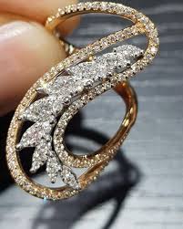 We Pride Ourselves In Having Extremely Strict Standards For Diamond Quality This Stunning S Shape Kinetic Jewelry Gold Rings Jewelry Contemporary Diamond Ring