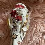 Glossy gold skull with roses and butterflies