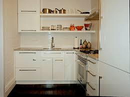 Cottage kitchens most often include farm sinks, simple moldings, and painted cabinets without added glazing. Kitchens