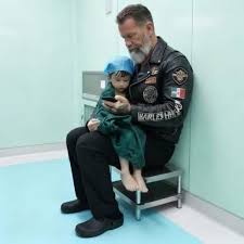 The boy asked me to hold his hand while he died because his dad wouldn't.  I'm a sixty-three-year-old biker covered in tattoos with a beard down to my  chest. I've buried war