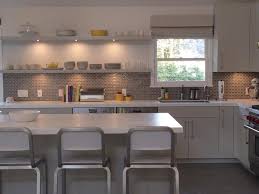The brick wall adds a layer of visual warmth. Yellow And Gray Kitchen Contemporary Kitchen Bella Mancini Design