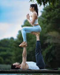 Partner yoga is a great way to get connected to your special someone. Challengepartner Beginnersyoga Nehakhincha Posesyoga Yogayoga Partner Couple Poses Acro Yoga Poses Photography Couples Yoga Poses Yoga Poses For Two