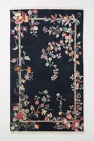 The contemporary design of the manseau area rug features oversized scrolling floral and vines that peek through a geometric grid of beige, cream, and. Ella Navy Floral Border Hand Knotted Rug