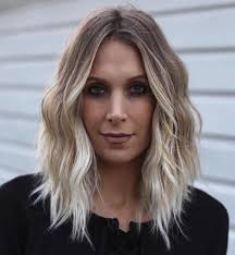 A long oval face haircut with layers and a middle part is the 60s/70s boho chic. 60 Super Chic Hairstyles For Long Faces To Break Up The Length