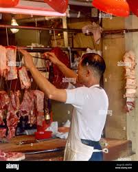 Butcher in Stanley Market, Stanley, Hong Kong Island, Hong Kong Stock Photo 