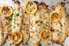 Garlicky Lemon Baked Tilapia Is Crazy Addicting Recipe Flounder Recipes Baked Tilapia Recipes Tilapia Recipes