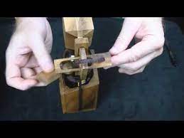 It is trapped in the puzzle until you can solve it. Wine Or Beer Bottle Wood Brain Teaser Puzzle How To Get The Bottle Out Creativecrafthouse Com Youtube