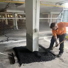 Repairs to the concrete columns of the multi-level parking garage. - R3 Construction