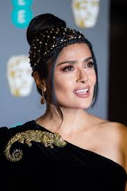 The mexican actress turned heads as she stepped onto the. Salma Hayek Reveals She Spilled Water On Eminem Before Impulsively Hugging Him Backstage At 2020 Oscars