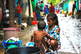 File:Indian girl bathing a child.jpg - Wikimedia Commons