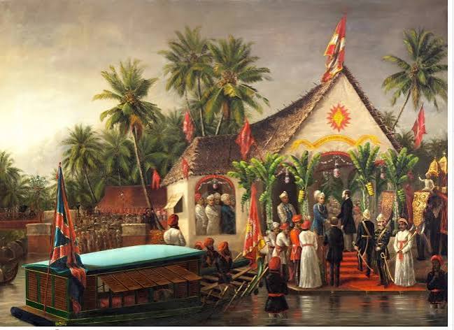 Photograph taken about 1900 by the Government photographer, Zacharias D'Cruz of the Travancore Maharaja's State Carriage in Trivandrum. It was drawn by a team of six horses. In the background can be