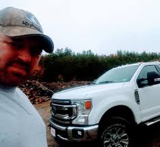 Who can provide lawn care services in Raymond, NH?