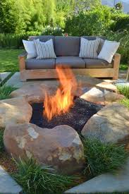 Fire pit glass stones lowes. Use Three Large Local Sandstone Rxs For Bowl Of Fire Pit Set Against Stone Faced Retaining Wall Filled With Fire Bea Backyard Fire Backyard Fire Pit Backyard