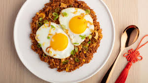 Nasi goreng refers to fried rice in both the indonesian and malay languages. Nasi Goreng Indonesian Fried Rice Egg Farmers Of Alberta