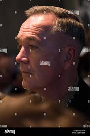 Gen. Joseph F. Dunford Jr, and his wife, Ellyn Dunford, render honors after  laying a wreath at Section 60 in Arlington National Cemetery 22034890481  f4b071c20a o Stock Photo