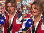 Tallia Storm goes braless under white shirt and Union Jack blazer