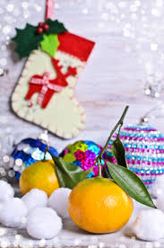 A glass of eggnog on a red plaid background. Here S Why We Put Oranges In Stockings At Christmas Kitchn